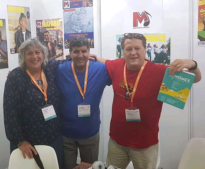 Nouri Ben Redjeb .Marguerite Horberg, Philip Weiss at the stand in las Palmas